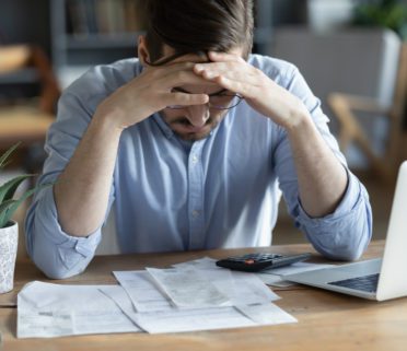 Sad Depressed Man Checking Bills Anxiety About Debt Or Bankruptcy